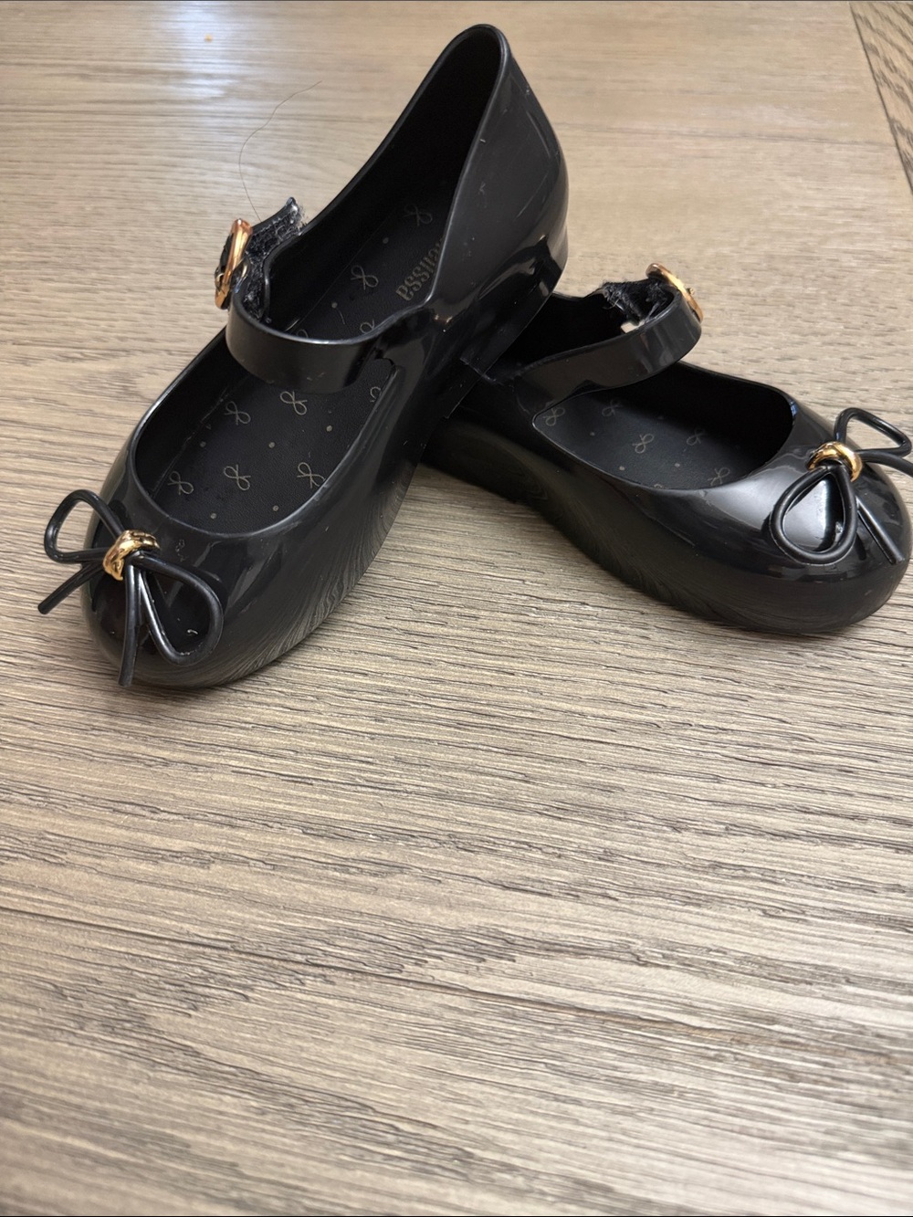 Mini Melissa Black Mary Jane Flats with Gold Bow Accent